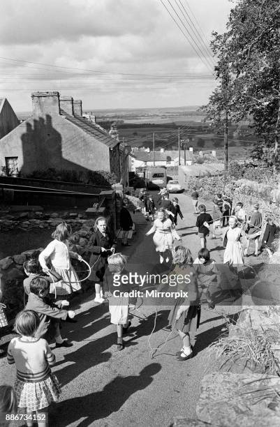 General shots of the village Rhiwlas, in Bangor, Gwynedd, Wales. Children playing outdoors, 20th September 1964.
