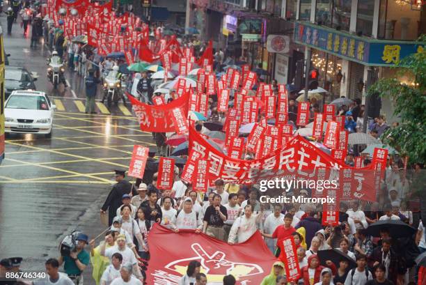 Pro Democracy demonstration on the streets of Hong Kong , shortly before the official handover from Britain to China. June 1997.