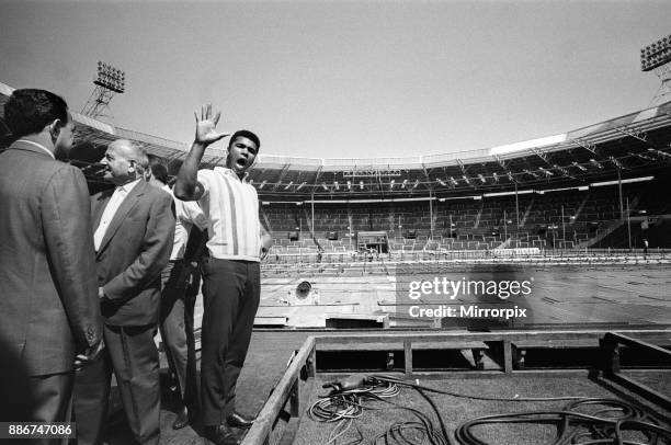 Cassius Clay at Wembley Stadium where his non-title bout against Britain's Henry Cooper will be held, 11th June 1963.