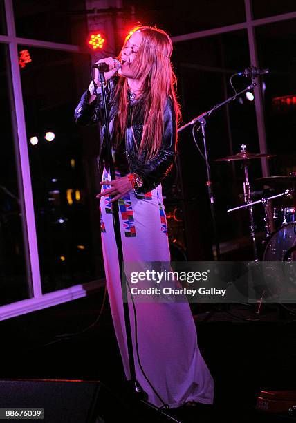 Actress and singer Taryn Manning performs alongside former Guns 'n' Roses guitarist Gilby Clarke at the Jose Cuervo Platino Penthouse with 944...