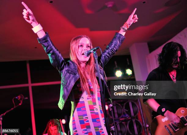 Actress and singer Taryn Manning performs alongside former Guns 'n' Roses guitarist Gilby Clarke at the Jose Cuervo Platino Penthouse with 944...