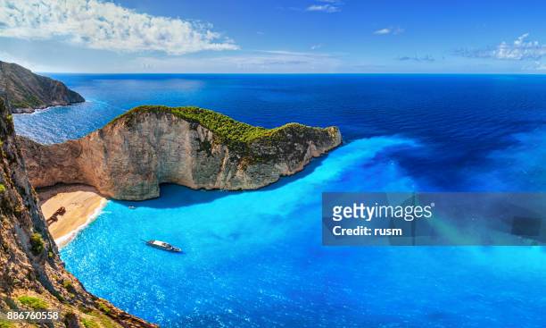 panorama of navagio beach (shipwreck beach), zakynthos island, greece. - greece stock pictures, royalty-free photos & images