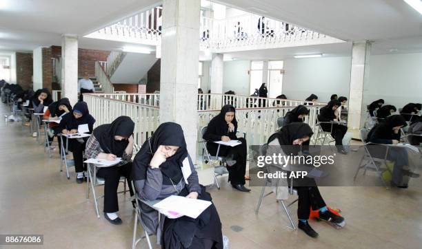 Iranian high school students sit for their university entrance examination in Tehran on June 25, 2009. Iran has jailed more than 140 political...