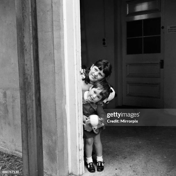 Jimmy Tarbuck and his wife Pauline pictured at Stanborough Hospital, Watford, with their new baby son, James. Their daughters, Cheryl and Liza, look...