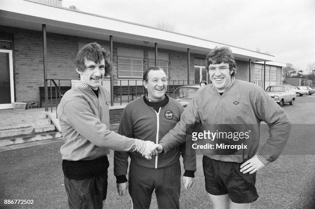 Terry McDermott, new Liverpool signing, reports for training at Melwood, 14th November 1974. Pictured with team captain Emlyn Hughes and manager Bob...