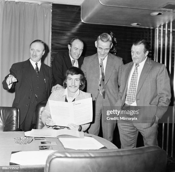 Terry McDermott, midfielder, formerly of Newcastle United, signs for Liverpool Football Club. Pictured with Chairman John Smith, Secretary Peter...
