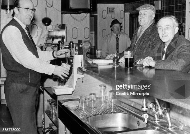 Happy customers at the 'Copper Top' drink a toast to being named a super pub of the future by Dr Christopher Clayson. He was impressed with the...