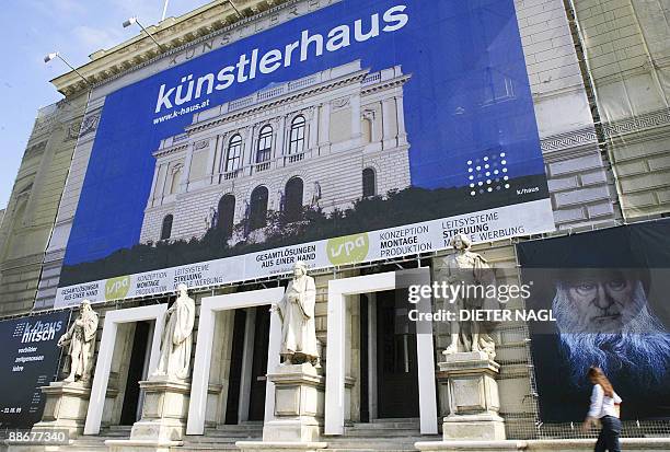 Pedestrians pass by the Kunstlerhaus Museum, where an exhibition named "Vorbilder, Zeitgenossen, Lehre" of Austrian leading visual artist Hermann...