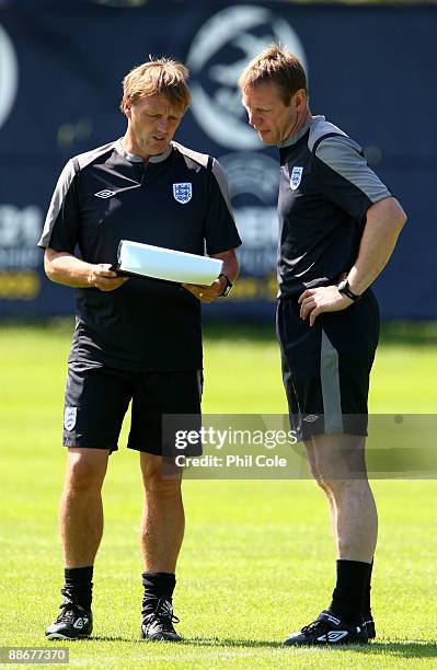 Stuart Pearce, manager of England talks with assistant, Steve Wigley during a training session at the Ovrevi, on June 25, 2009 in Tvaaker, Sweden