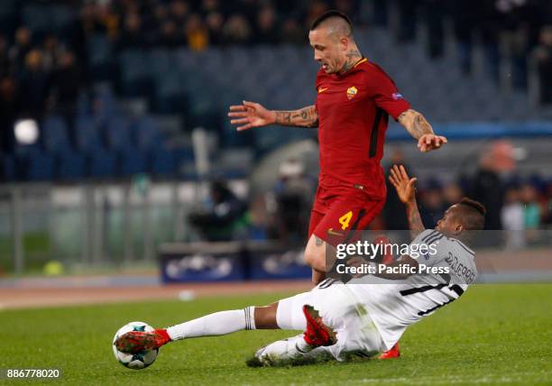 Roma Radja Nainggolan, left, is tackled by Qarabag Donald Guerrier during the Champions League Group C soccer match between Roma and Qarabag at the...
