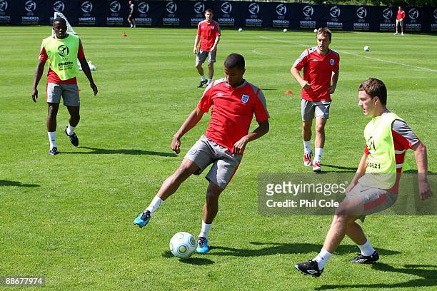 Fraizer Campbell of England with the ball is challenged by Craig Gardner during a training session at the Ovrevi, on June 25, 2009 in Tvaaker, Sweden