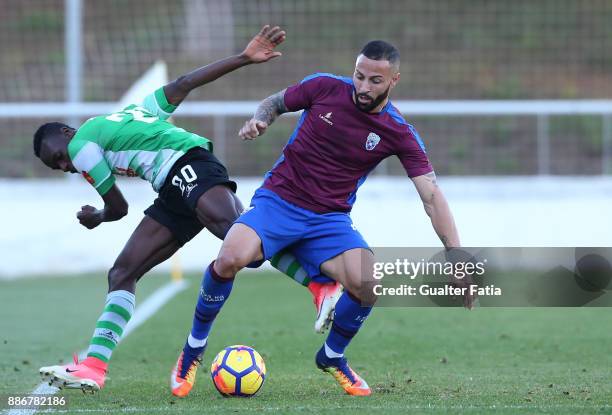 Cova da Piedade forward Hugo Firmino from Portugal with SC Covilha forward Sodiq Fatai from Nigeria in action during the Segunda Liga match between...