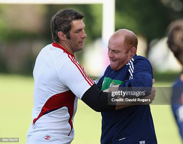 Simon Shaw, the Lions lock, warms up with Martyn Williams during the British and Irish Lions training session at Bishops School on June 25, 2009 in...