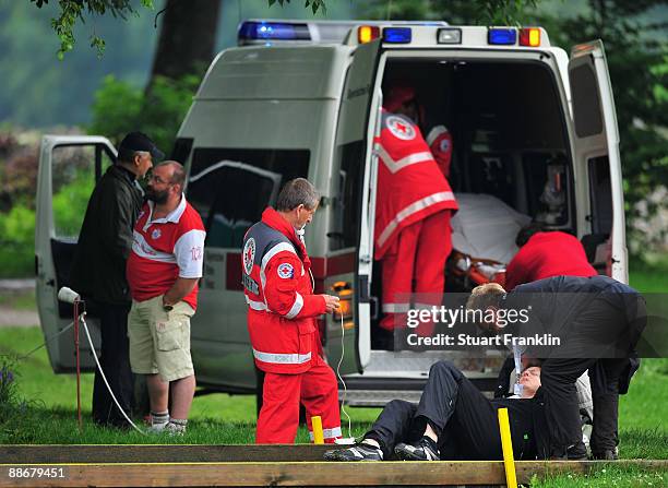 Lady is taken off the course after breaking her leg infront of players on the seventh hole during the first round of The BMW International Open Golf...