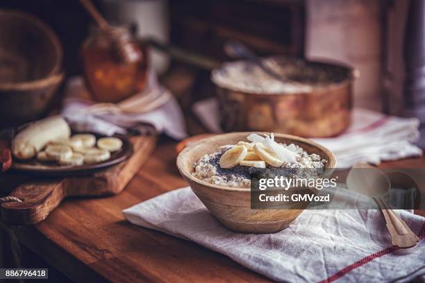 homemade banana coconut porridge with poppy seeds - bran stock pictures, royalty-free photos & images