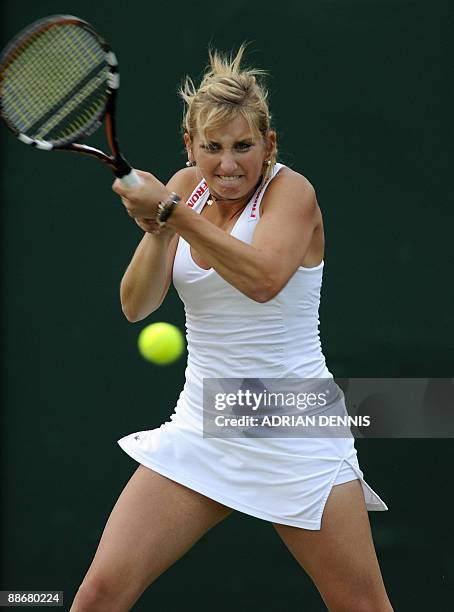 Switzerland's Timea Bacsinszky plays against France's Marion Bartoli at the All England Tennis Club on the third day of the Wimbledon Tennis...