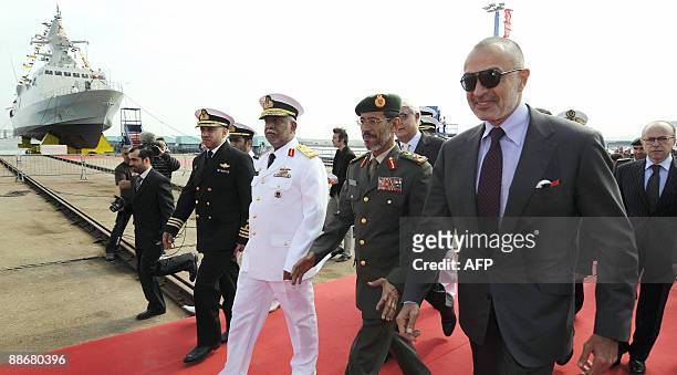 French shipbuilder Constructions Mecaniques' owner, French-Lebanese Ikandar Safa flanked by top military officials among them General Hamad Mohammed...