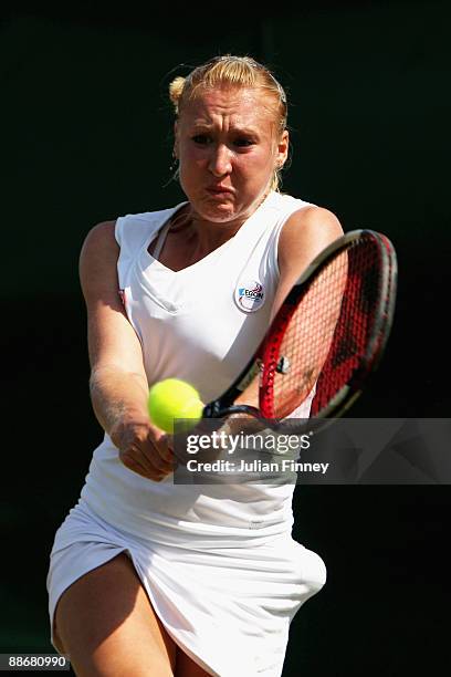 Elena Baltacha of Great Britain plays a backhand during the women's singles second round match against Kirsten Flipkens of Belgium on Day Four of the...