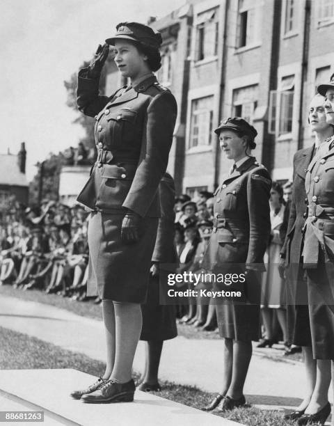 Princess Elizabeth takes the salute during a march-past of A.T.S. Cadets at the Imperial Services College, Windsor, 14th June 1946.