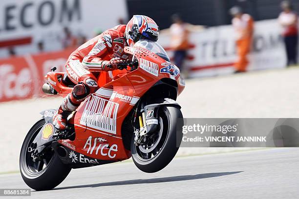 Ducati's Australian Casey Stoner is pictured during the first MotoGP free practice ahead of the Saturday Dutch TT Grand Prix held in Assen racetrack,...