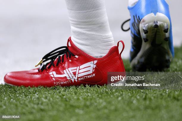 Cleats worn by Fozzy Whittaker of the Carolina Panthers are seen during a game against the New Orleans Saints at the Mercedes-Benz Superdome on...