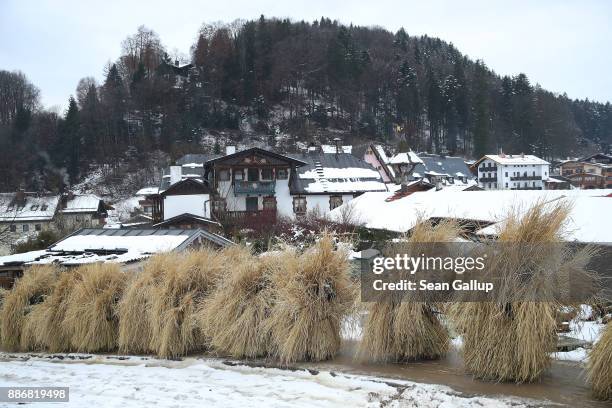 Men dressed in masks and straw in the form of a figure known locally as "Buttnmandl", or "Shaking Man", ascend on the outskirts of town to a meadow...