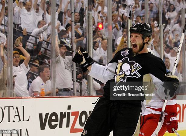 Jordan Staal of the Pittsburgh Penguins celebrates after scoring a goal in the second period against goaltender Chris Osgood of the Detroit Red Wings...