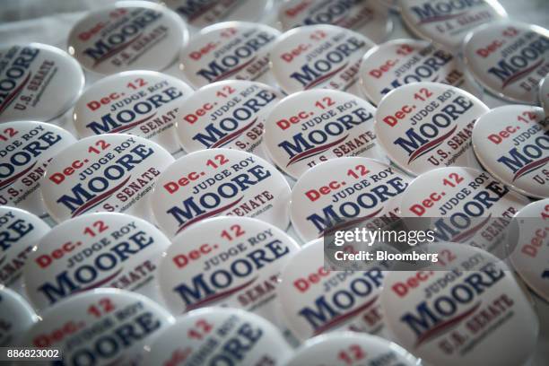Buttons sit on a table ahead of a campaign rally for Roy Moore, Republican candidate for U.S. Senate from Alabama, in Fairhope, Alabama, U.S., on...