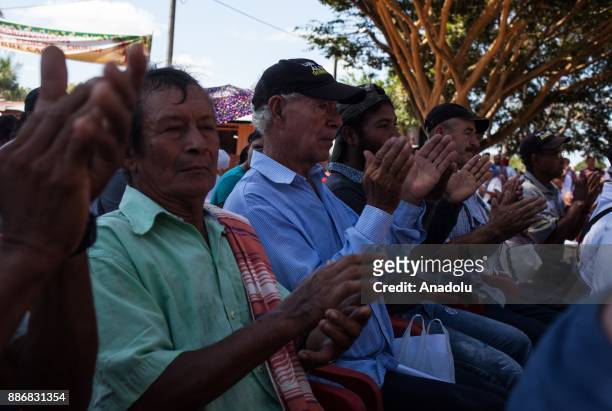 Locals of Guerima applause during a notification in Vichada, Colombia on December 05, 2017. Locals of Guerima follow the conditions carefully,...