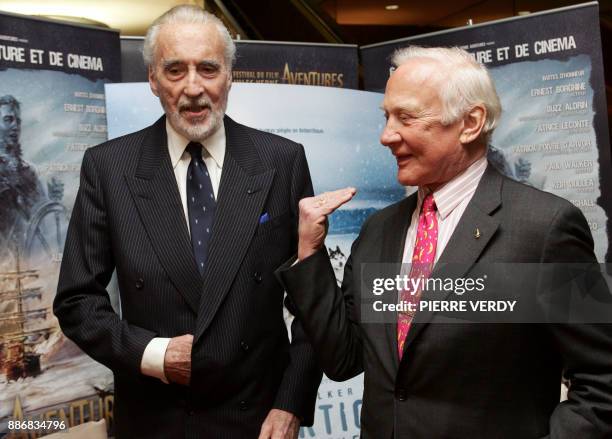 British actor Christopher Lee and US astronaut Buzz Aldrin pose during the opening of the Jules Verne Film Festival, 22 March 2006 in Paris. The film...