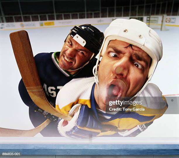 ice hockey player checking opponent on to glass wall (composite) - checking ice hockey stock-fotos und bilder