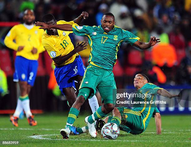 Ramires of Brazil competes for the ball with Bernard Parker and Steven Pienaar of South Africa during the FIFA Confederations Cup Semi Final match...