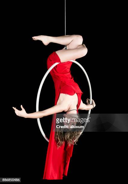 female aerial dancer in red dress - acrobatics gymnastics stock pictures, royalty-free photos & images