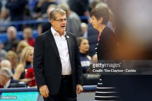Head coach Geno Auriemma of the Connecticut Huskies and head coach Muffet McGraw of the Notre Dame Fighting Irish greet each other before the the...
