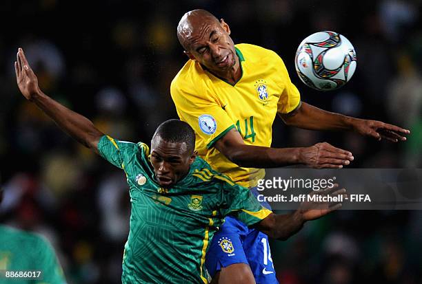 Luisao of Brazil tackles Bernard Parker of South Africa during the FIFA Confederations Cup Semi Final match beween Brazil and South Africa at Ellis...