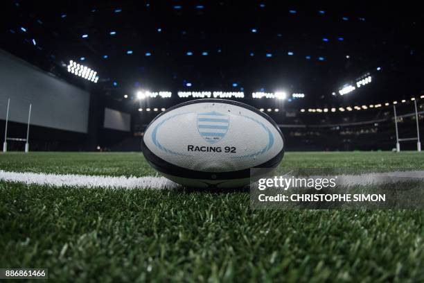 Rugby ball of the Racing 92 rugby club is seen on the synthetic field of the U Arena in Nanterre near Paris on December 6, 2017. / AFP PHOTO /...