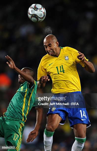 Luisao of Brazil tackles Bernard Parker of South Africa during the FIFA Confederations Cup Semi Final match beween Brazil and South Africa at Ellis...