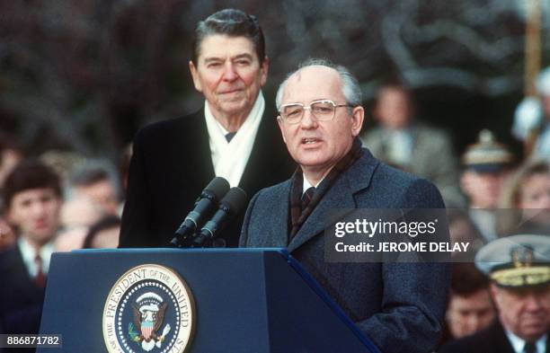 This 08 December,1987 photo shows US President Ronald Reagan with Soviet leader Mikhail Gorbachev during welcoming ceremonies at the White House on...