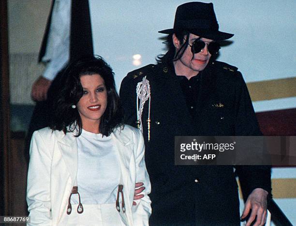 This August 16, 1994 file photo shows US pop star Michael Jackson and his then wife Lisa-Marie Presley arriving at the airport in Budapest. Jackson...