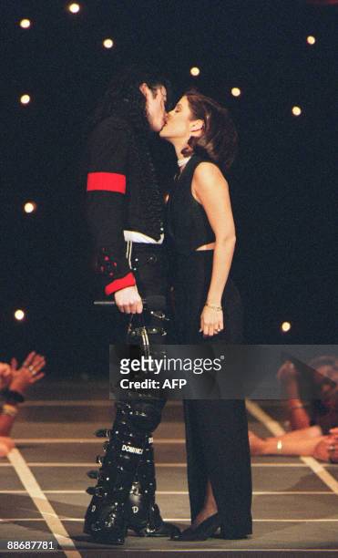 This September 8, 1994 file photo shows US pop star Michael Jackson and his then wife Lisa-Marie Presley kissing on the stage of Radio City Music...