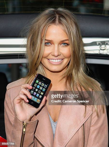 Lara Bingle launches the new iPhone 3G S at the Vodafone store in Pitt Street prior to delivering the phones to customers who have pre-ordered the...