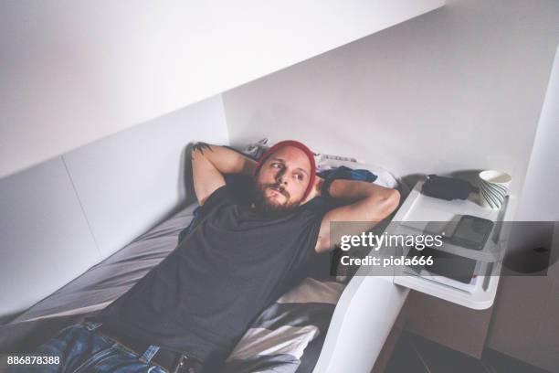 pescador relajante en la cabina de un barco de pesca - photograph of sleeping sailors fotografías e imágenes de stock