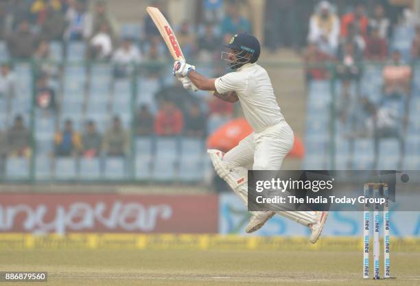 Shikhar Dhawan of India plays a shot during fourth day of the third cricket test match against Sri Lanka, at Ferozshah Kotla in New Delhi.