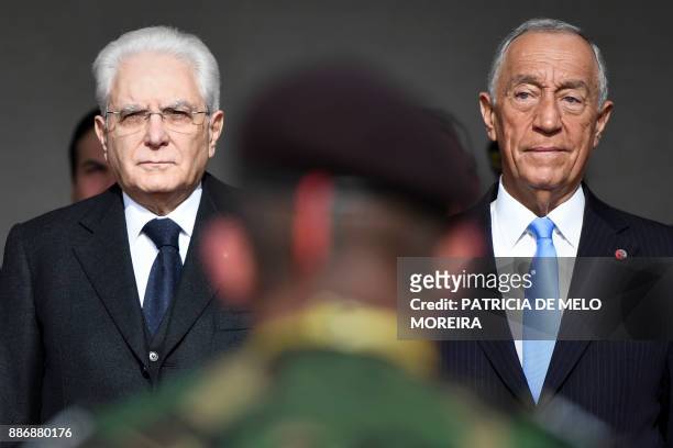 Portuguese President Marcelo Rebelo de Sousa and his Italian counterpart Sergio Mattarella stand watching a military parade at Jeronimos Monastery in...