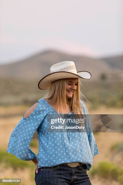 cowgirl dancing in the countryside - line dancing stock pictures, royalty-free photos & images