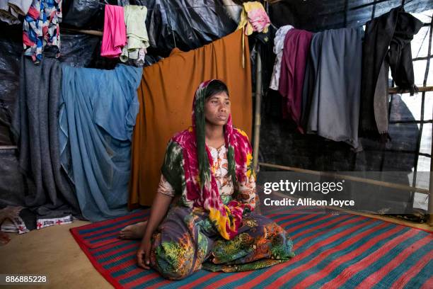 Dildar Begum poses for a photo on December 3, 2017 in Cox's Bazar, Bangladesh. She fled to Bangladesh shortly after the August 25th attack from Tula...