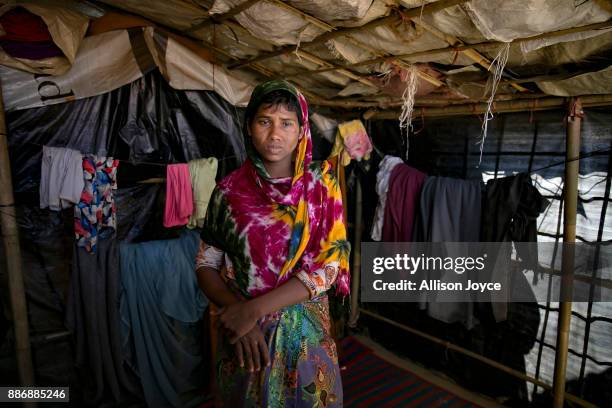 Dildar Begum poses for a photo on December 3, 2017 in Cox's Bazar, Bangladesh. She fled to Bangladesh shortly after the August 25th attack from Tula...