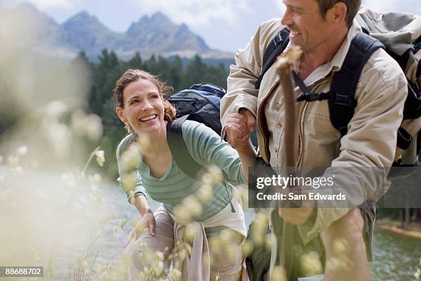 couple hiking in remote area - couple hiking stock-fotos und bilder