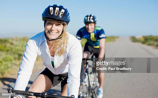 couple bike riding in remote area - cycling stock pictures, royalty-free photos & images