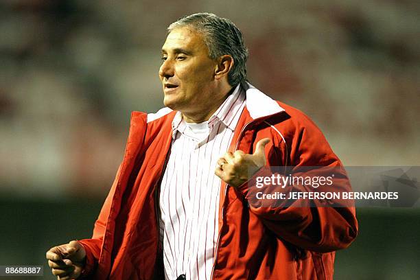 Brazil's Internacional head coach Tite gestures during their 2009 Recopa Sudamericana football match against Ecuador's Liga de Quito, on June 25,...